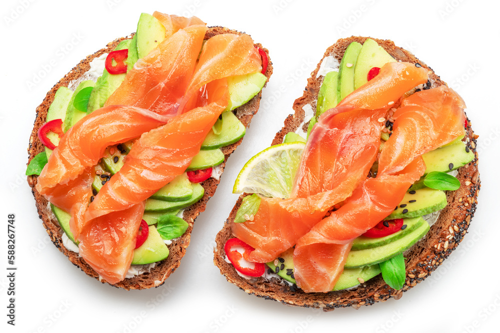 Salmon toasts with avocado isolated on white background. Top view. Salmon toasts with avocado isolated on white background. Top view.
