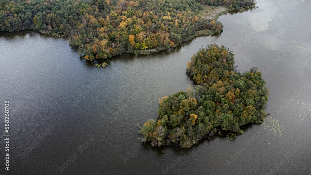 Obraz premium Aerial view of autumnal islands and calm sea