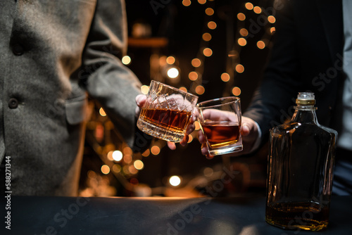 Businessman pouring whiskey victory drink