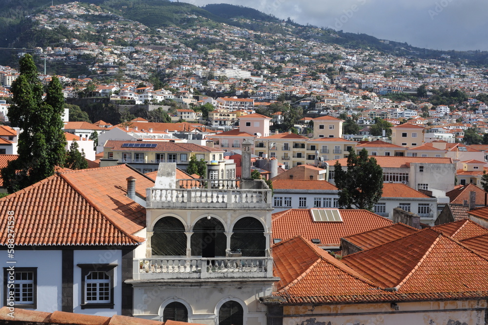 Panoramic view of the old town of Funchal, Madeira island, Portugal with red tile roofs and historical buildings