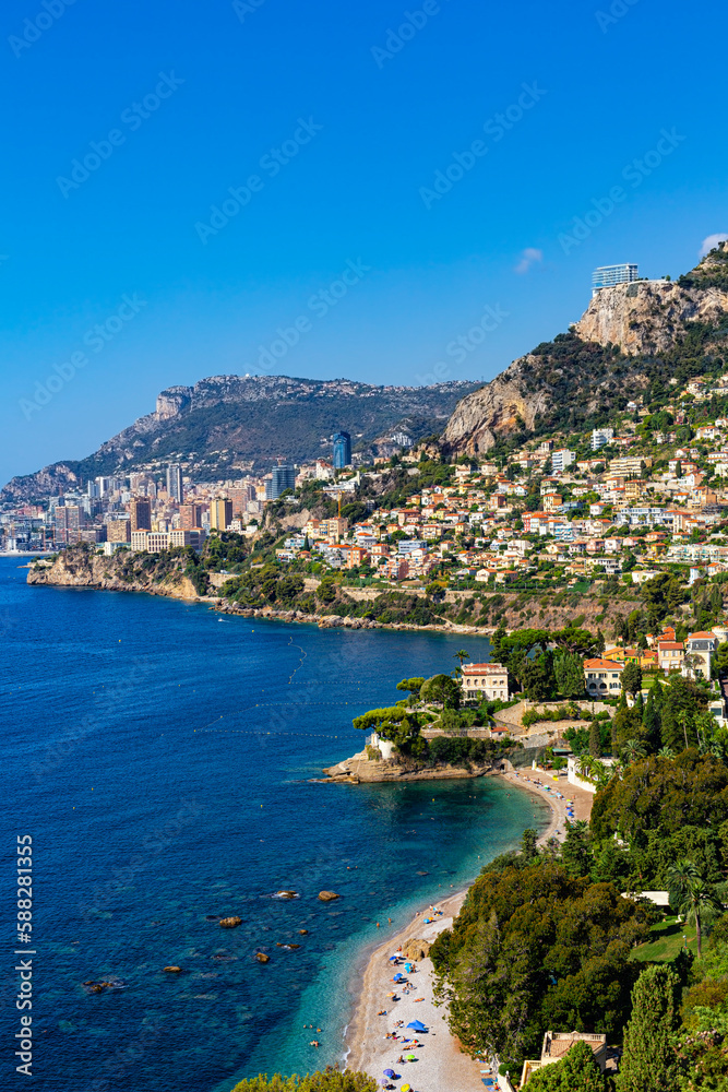 High angle view of Monaco, Monte Carlo,  from Roquebrune, France. Panoramic view. Summer 2022. Vertical image.