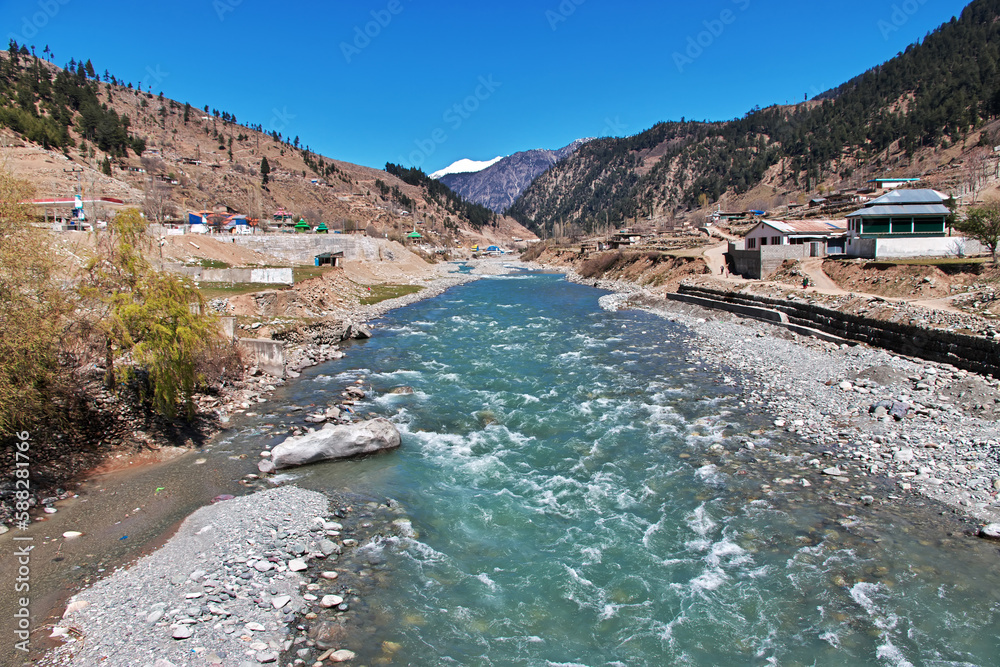 Fototapeta premium Swat river in the valley of Himalayas, Pakistan