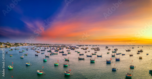 Aerial view of Mui Ne fishing village in sunset sky with hundreds of boats anchored to avoid storms  this is a beautiful bay in central Vietnam