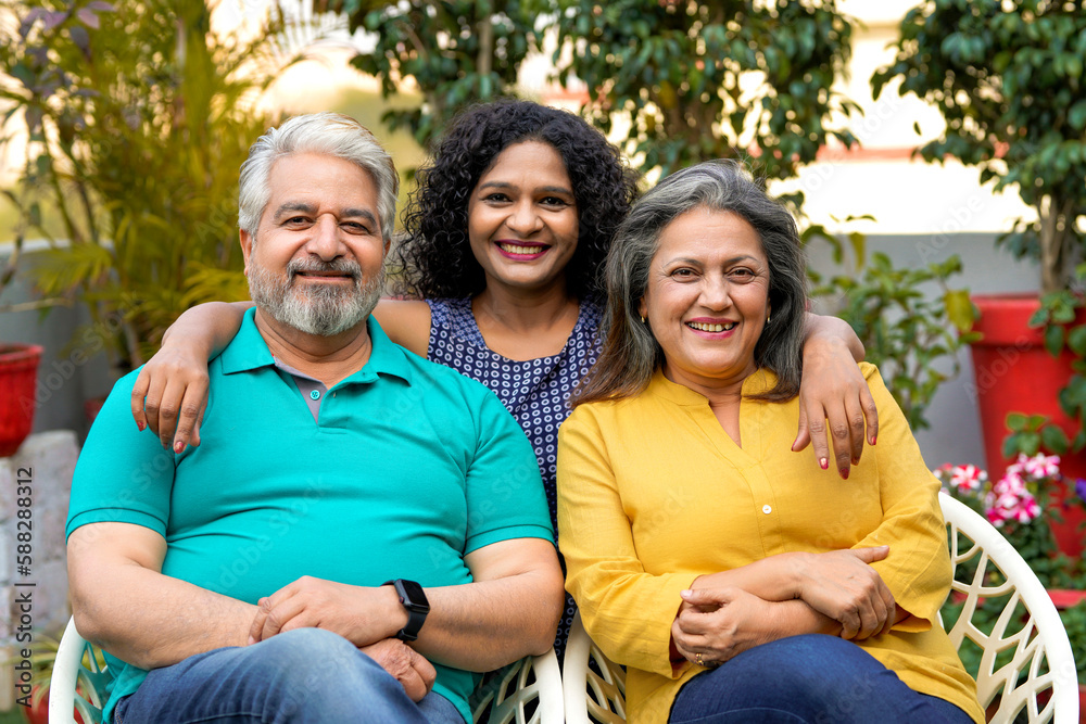 Indian senior couple with young daughter Stock Photo | Adobe Stock