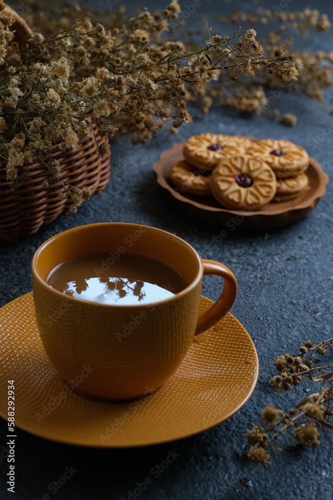 coffee, cookies and dried flower on the table
coffee, cookies and dried flower on the table