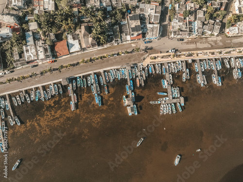 Aerial view of boats docked at the pier along the coast in Rio Lagartos, Yucatan, Mexico. photo