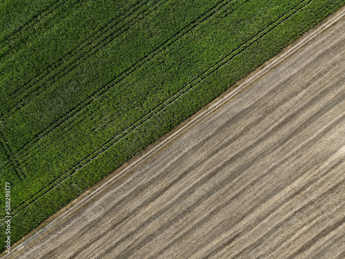 Aerial view of cereal harvesters and tractors at a farm in Oderbruch, Brandenburg, Germany. photo