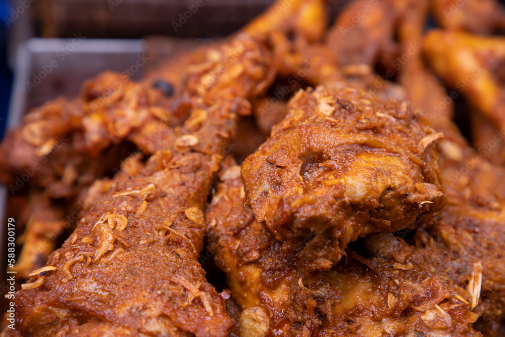 Roasted leg pieces of mutton at a street food market in Dhaka, Bangladesh Roasted leg pieces of mutton at a street food market in Dhaka, Bangladesh