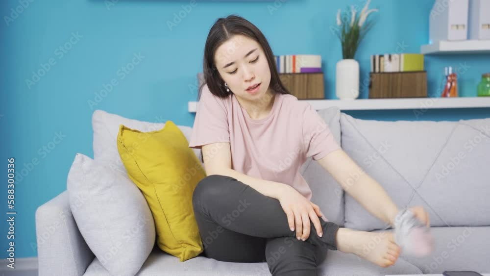 Young woman's feet and socks smell. The socks of the young woman with