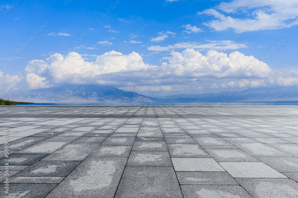 Empty square floor and lake with mountain background