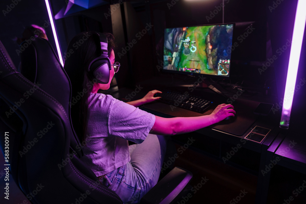 Woman playing video game in cybersport club Woman playing video game in cybersport club