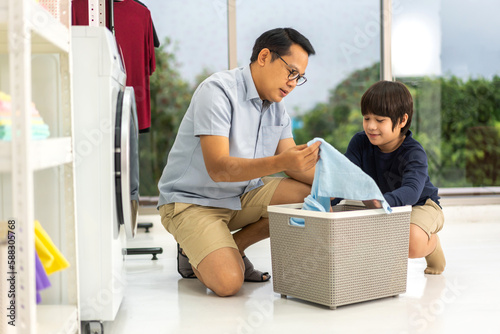 Картината върху платно Family asian father and kid little boy son having fun doing household chores doi