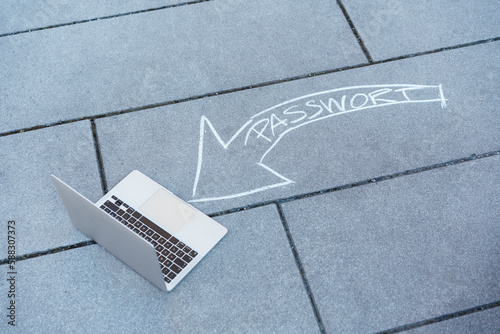 Laptop and password text arrow on road photo