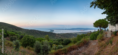 Italy, Tuscany, Monte Argentario, Panoramic view from Monte Argentario peninsula at dusk photo