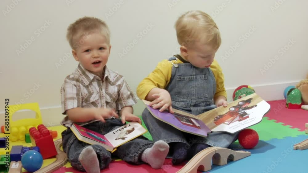 Boys sitting with books