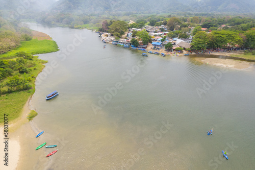 Aerial view of a village by the river photo