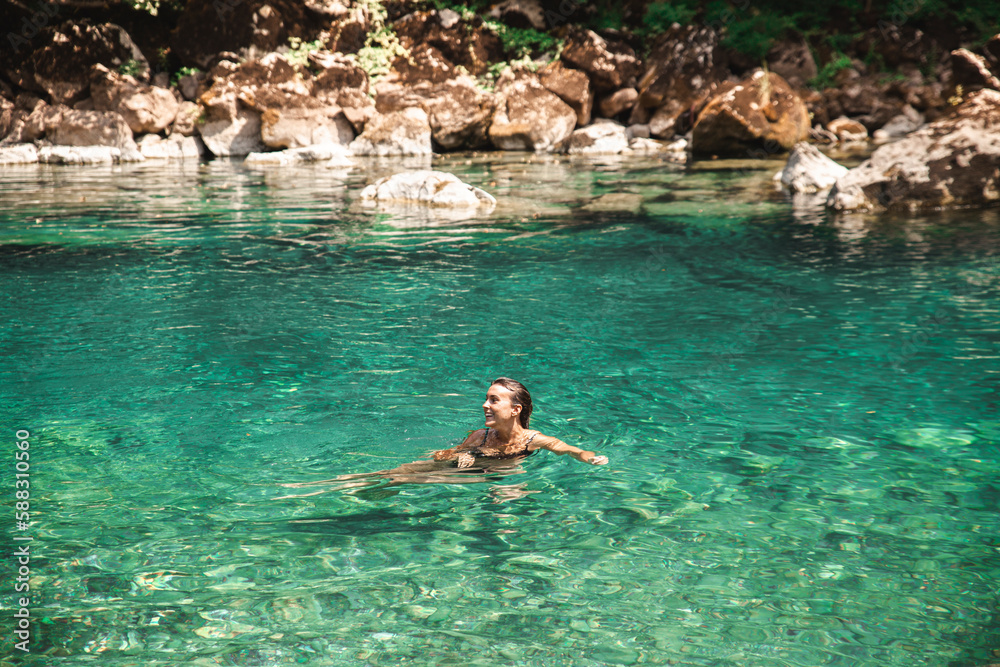 Young woman swimming in Tara river Young woman swimming in Tara river