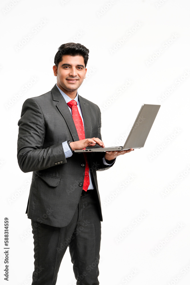 Young indian Businessman using laptop on white background. Young indian Businessman using laptop on white background.