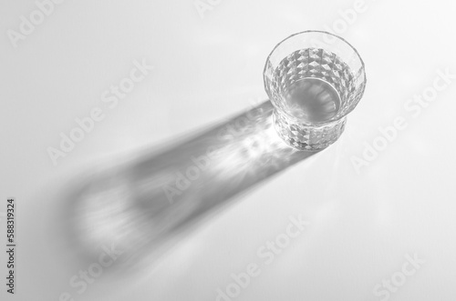 A Glass with Water and Sharp Shadows, Caustic Effect as Light Passes Through
