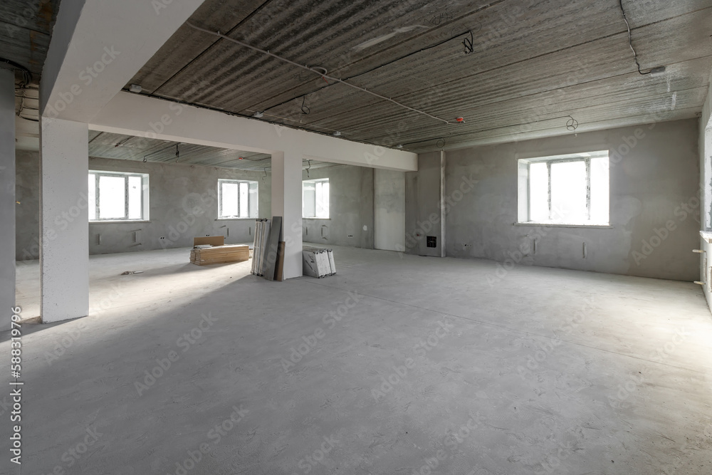 Spacious empty rooms in the attic floor after filling out the work on the wall and ceiling Spacious empty rooms in the attic floor after filling out the work on the wall and ceiling