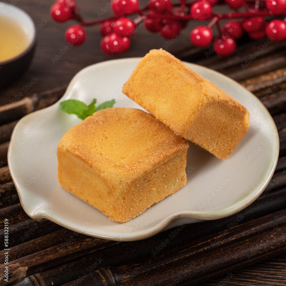 Delicious pineapple cake pastry in a plate on wooden table background with tea. Delicious pineapple cake pastry in a plate on wooden table background with tea.