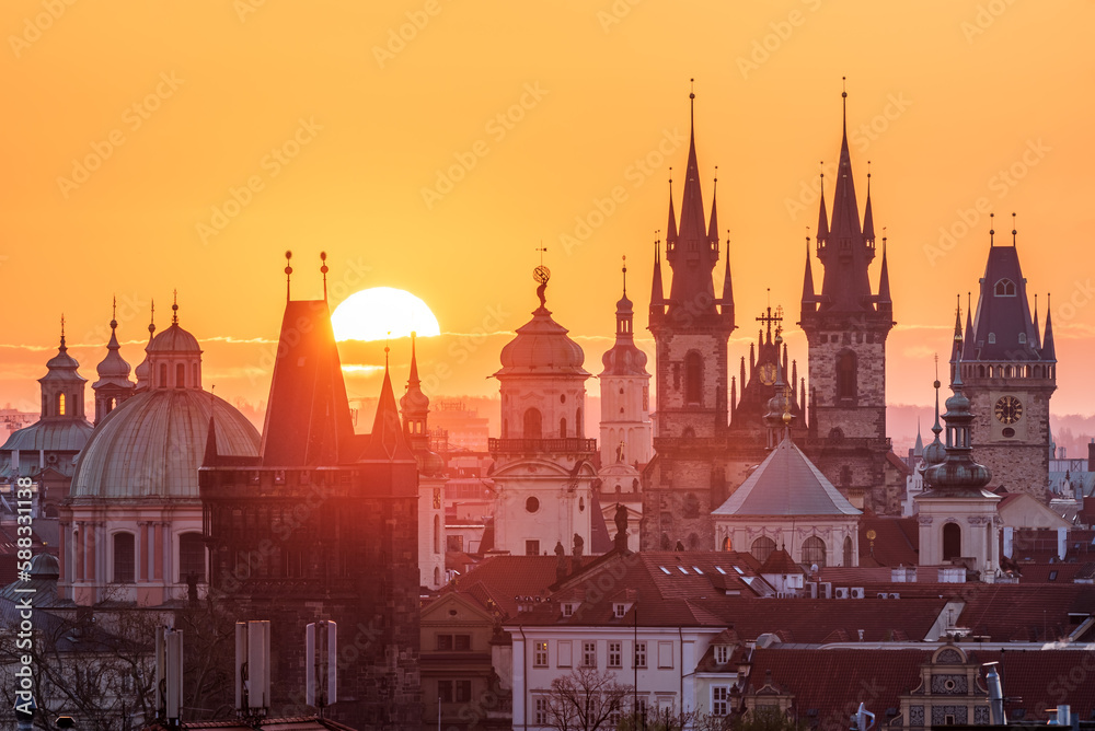 A rising sun above the cityscape of Prague. 