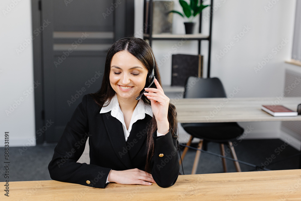 Call center agent with headset working on support hotline in modern office. Video conference. Call center agent with headset working on support hotline in modern office. Video conference.