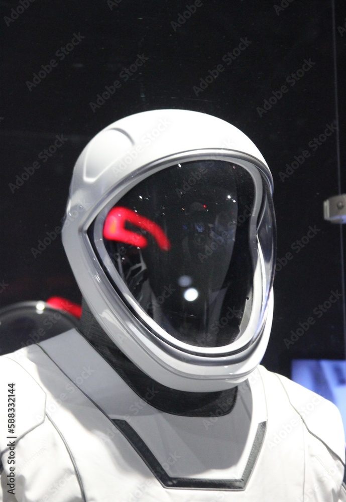 Fototapeta premium Portrait of white space suit and helmet for astronaut studio light. Empty space suit. Astronaut gear. With copy space. 