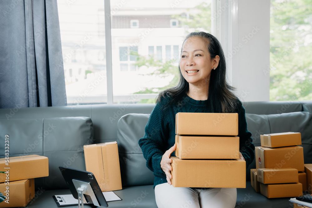 adult woman holding parcels and looking to camera, standing among several boxes in modern office. adult woman holding parcels and looking to camera, standing among several boxes in modern office.