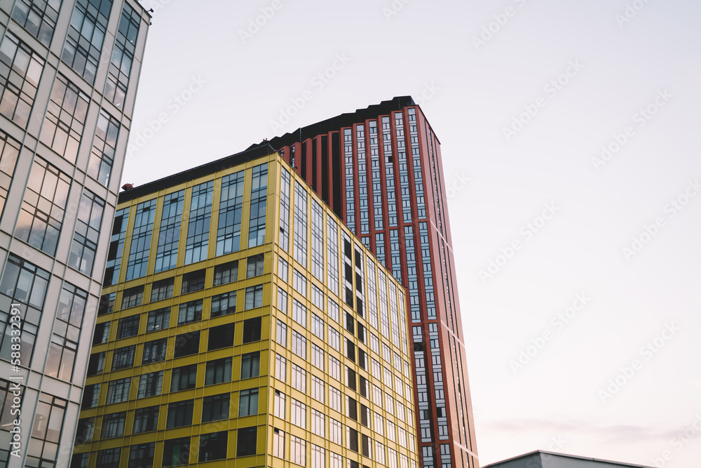 High rise buildings under cloudless blue sky