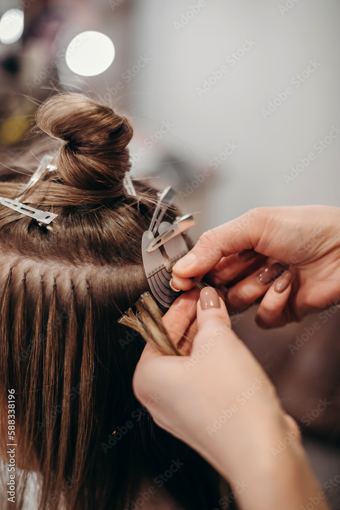 Fototapeta premium hairdresser cutting hair