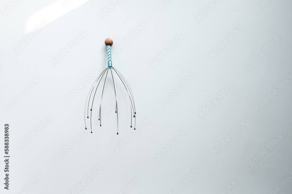 Head massage tool on white background. Relax, healthcare concept. Top view, flat lay, copy space
