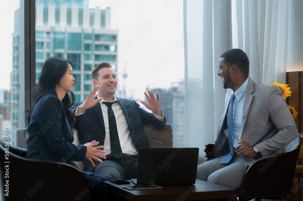 New business group discuss and exchange ideas while relaxing in the office room.