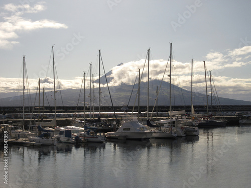 Azores Faial Harbor with Small Boats and View on Pico Island Volcano in Background