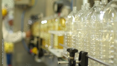 Wallpaper Mural Factory worker organicing plastic bottles in the product line of Industrial factory Torontodigital.ca