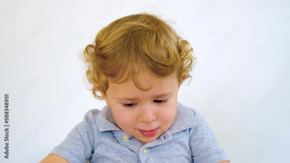 The child eats pasta and vegetables. Selective focus. The child eats pasta and vegetables. Selective focus.