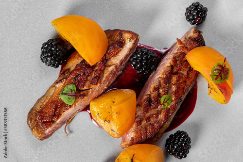 Fototapeta Naklejka Na Ścianę i Meble -  Duck breast with blackberries and peaches