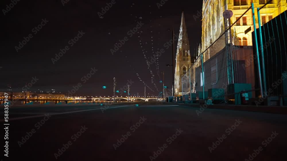 Drones landing on road in night city on embankment outdoors. Pilotless equipment for show on street with no people Drones landing on road in night city on embankment outdoors. Pilotless equipment for show on street with no people