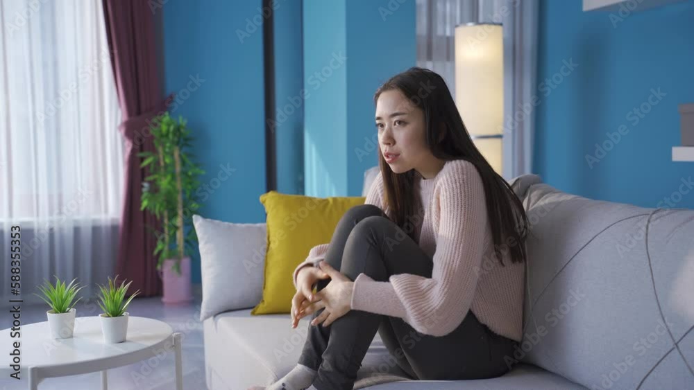 Depressed woman worried and agitated.
The woman at home is thinking scared, nervous and worried, looks around.
Depressed woman worried and agitated.
The woman at home is thinking scared, nervous and worried, looks around.