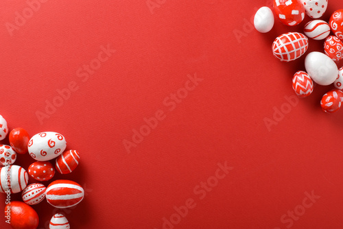 Easter backgrounds, scattered Easter red and white eggs on a bright red background.