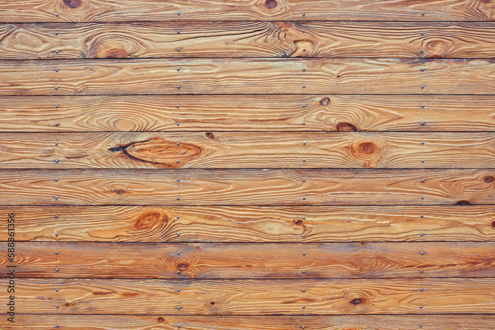 Naklejka premium Texture of wet, brown, narrow, horizontal fence boards