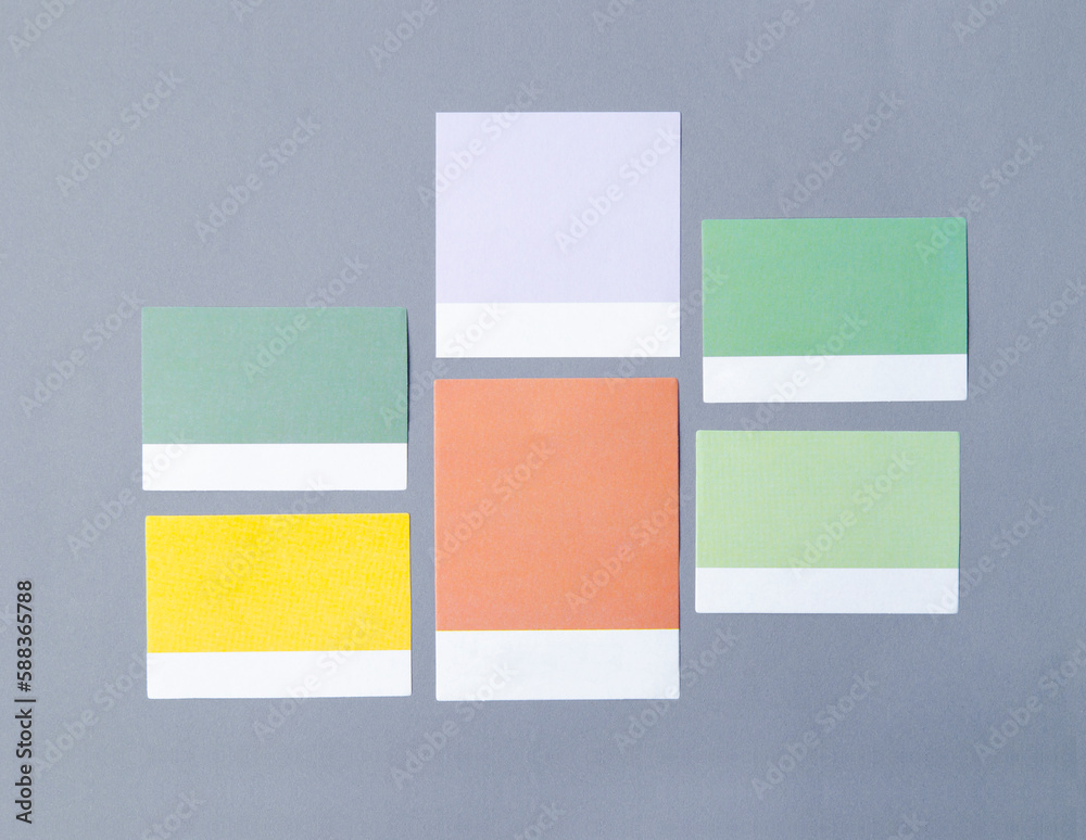 The Colorful blank notes adhesives paper for your text or message on grey background.
