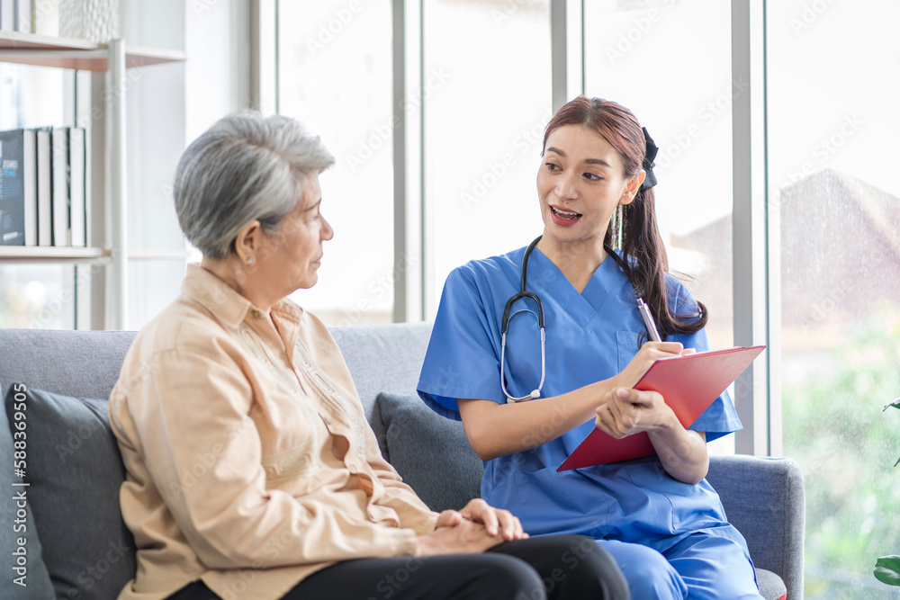 Asian women are being cared for by nurses who monitor health and physical therapy for elderly women living alone at home. by walking on a cane or using muscles Asian women are being cared for by nurses who monitor health and physical therapy for elderly women living alone at home. by walking on a cane or using muscles
