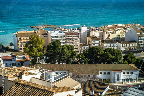 The classic Spanish white town of Altea. View from the old town to the Mediterranean Sea, the modern part of the city and the Benidorm apartment buildings