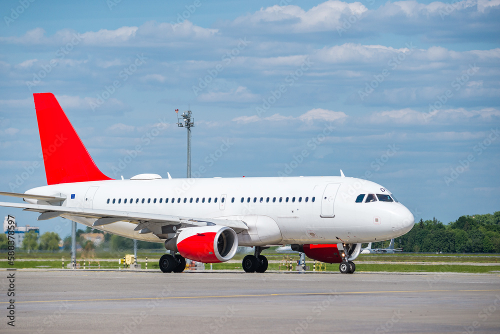 Passenger airplane on runway at sunny day Passenger airplane on runway at sunny day
