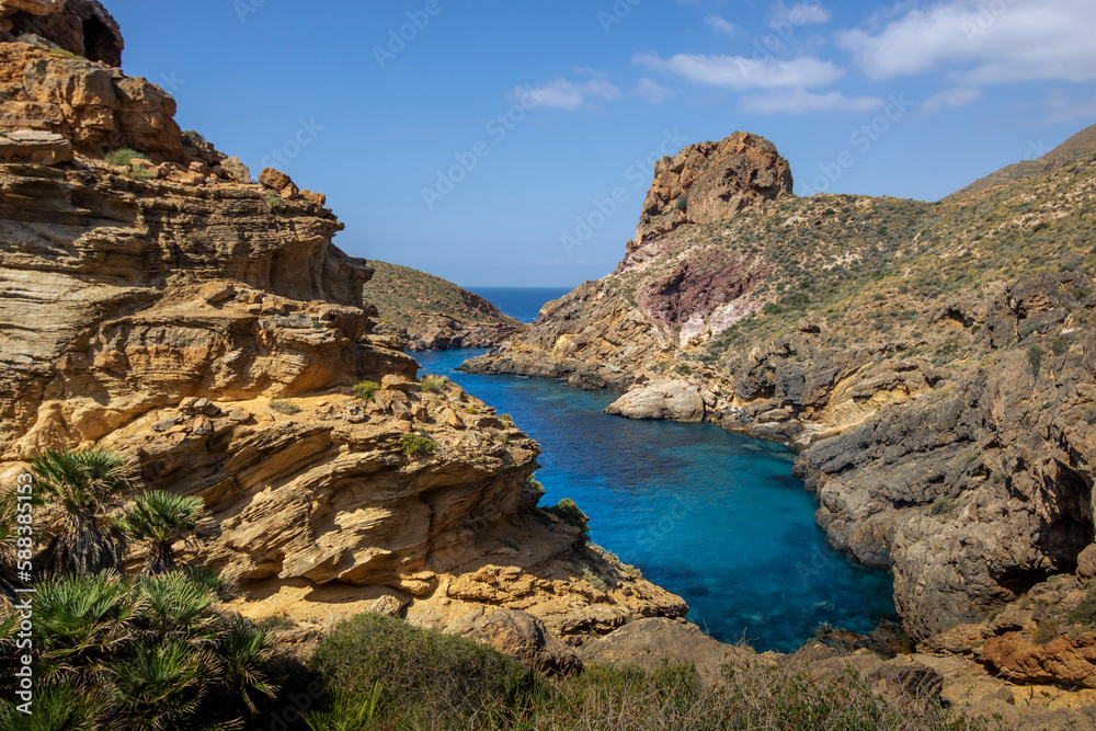 Mountainous environment with cove of blue waters in the background of the coast of Cartagena, Spain, Region of Murcia