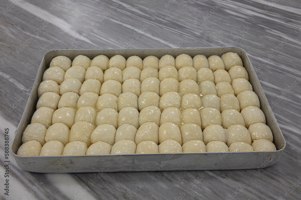 A piece of Bosnian style burek. It is a pastry filled with seasoned meat and onions and baked in an oven. Traditional Bosnian pastry manti borek. Turkish name; Bosnak Mantisi. A piece of Bosnian style burek. It is a pastry filled with seasoned meat and onions and baked in an oven. Traditional Bosnian pastry manti borek. Turkish name; Bosnak Mantisi.