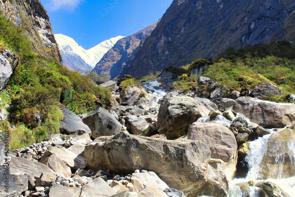 Mount Hiunchuli and Annapurna South loom over the narrow valley of the Modi khola on the way towards Deurali along the Annapurna base camp trek Mount Hiunchuli and Annapurna South loom over the narrow valley of the Modi khola on the way towards Deurali along the Annapurna base camp trek