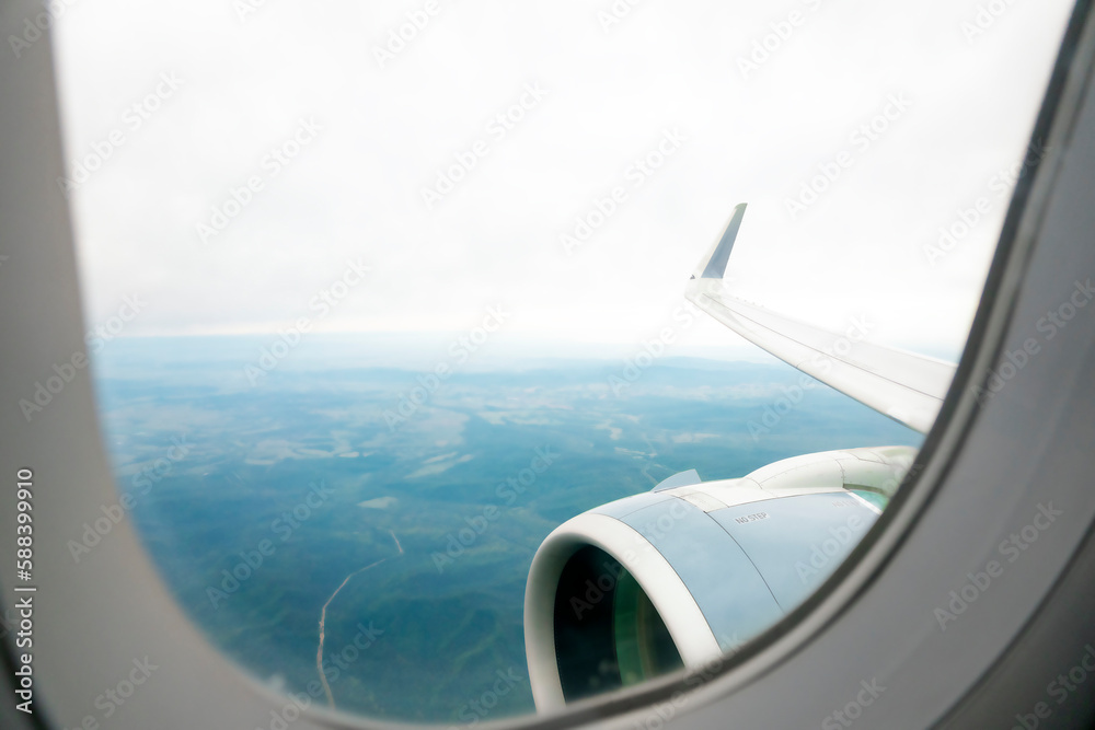 View from the window of the aircraft on the wing, engine and ground. View from the window of the aircraft on the wing, engine and ground.