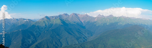 Panorama: view of the Bzerpi peak in the Caucasus mountains in summer on a sunny day